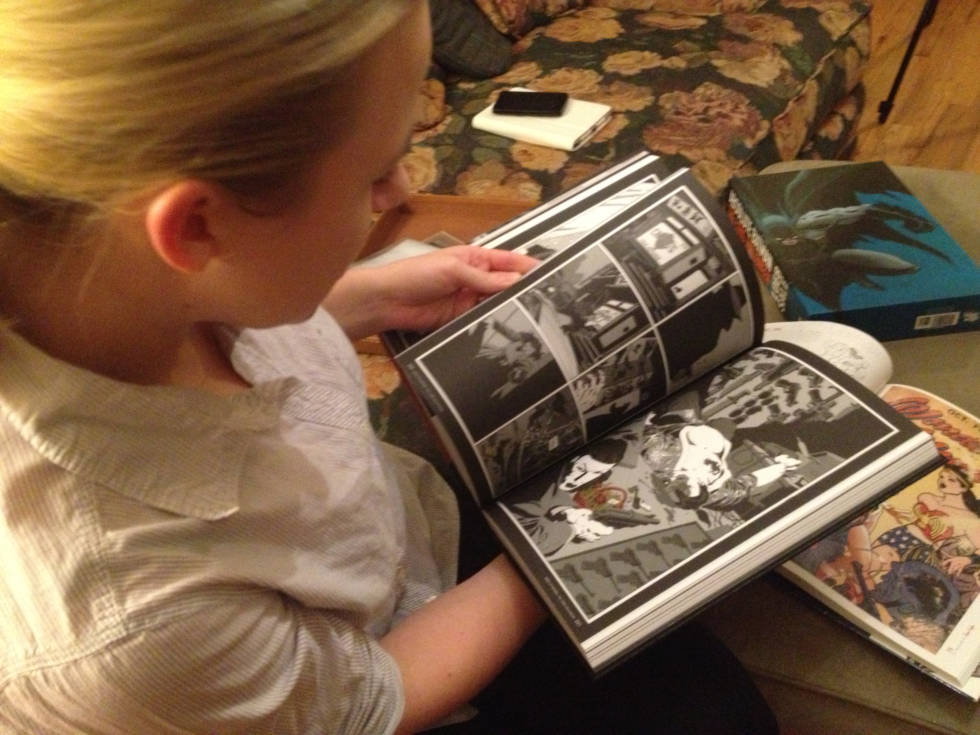 Woman reading a graphic novel.