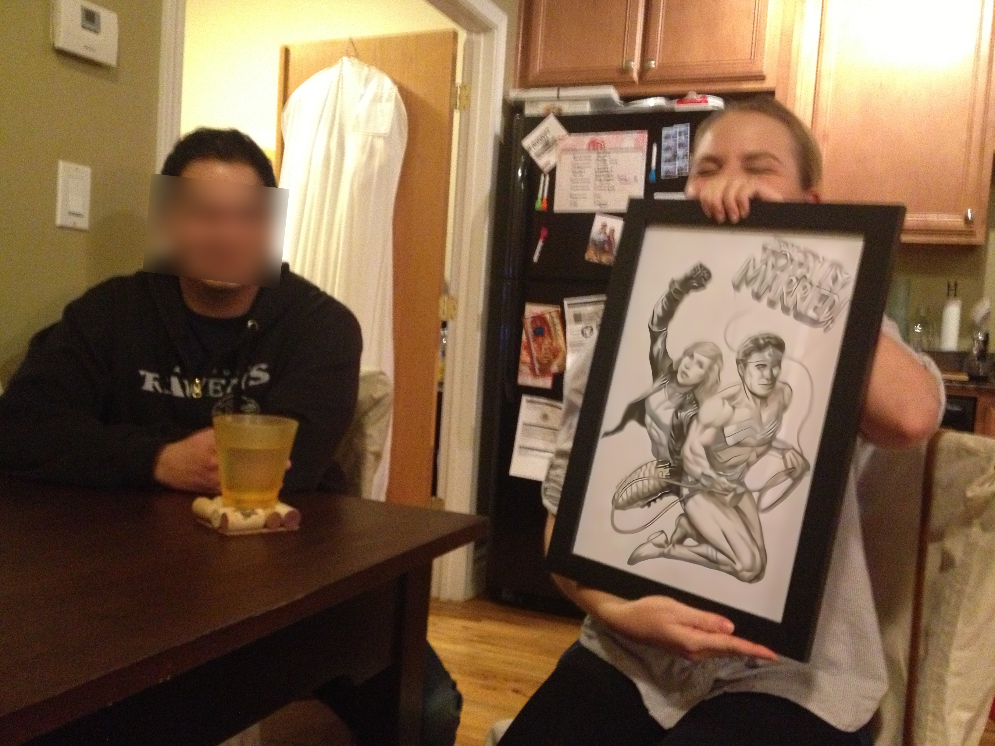 A couple showing a comic drawing